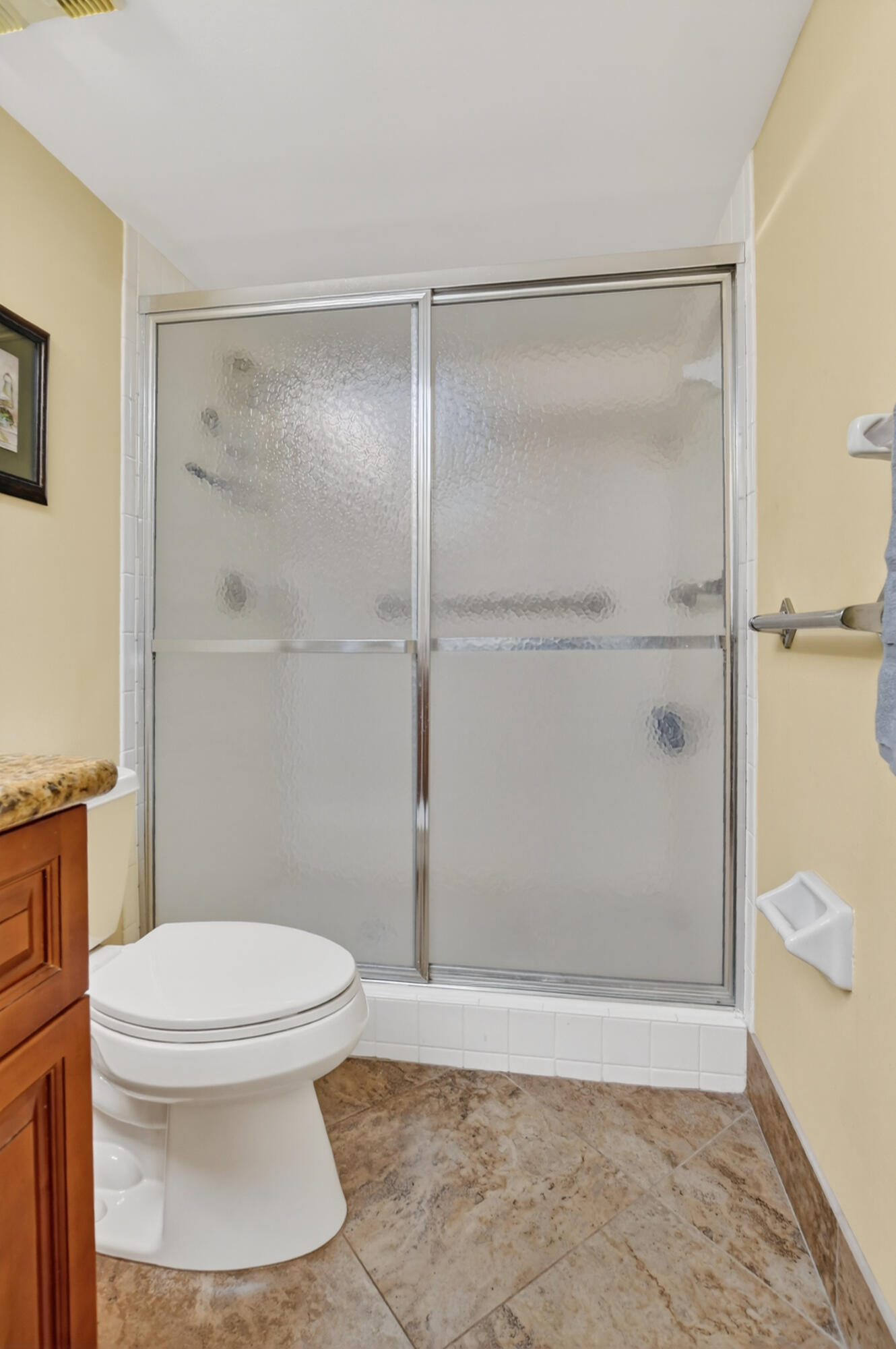 23345 Carolwood Lane, Unit 205 Boca Raton, FL 33428 - Photo 19 of 59 a white toilet sitting next to a bathroom sink