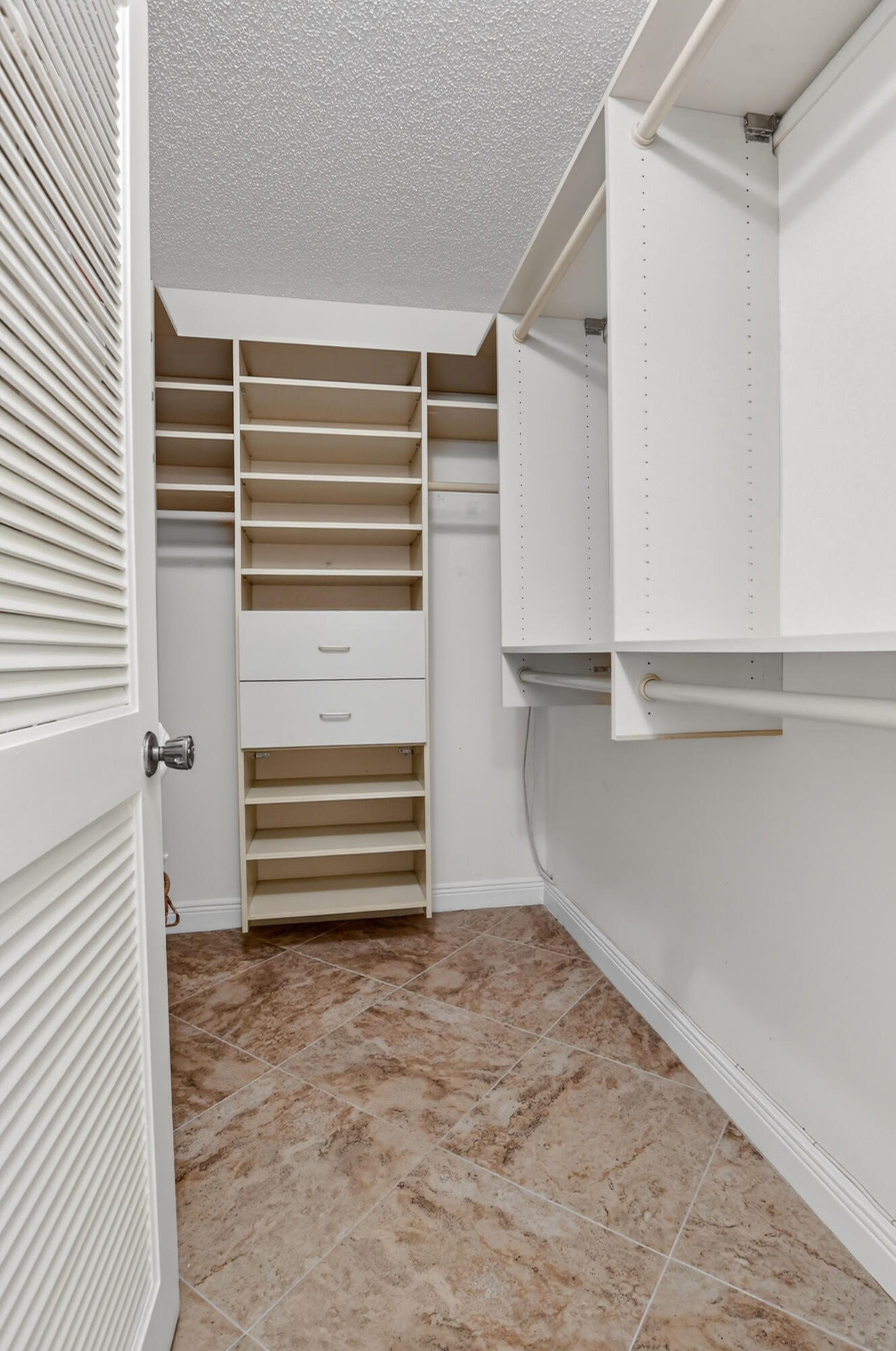 23345 Carolwood Lane, Unit 205 Boca Raton, FL 33428 - Photo 20 of 59 a view of walk in closet