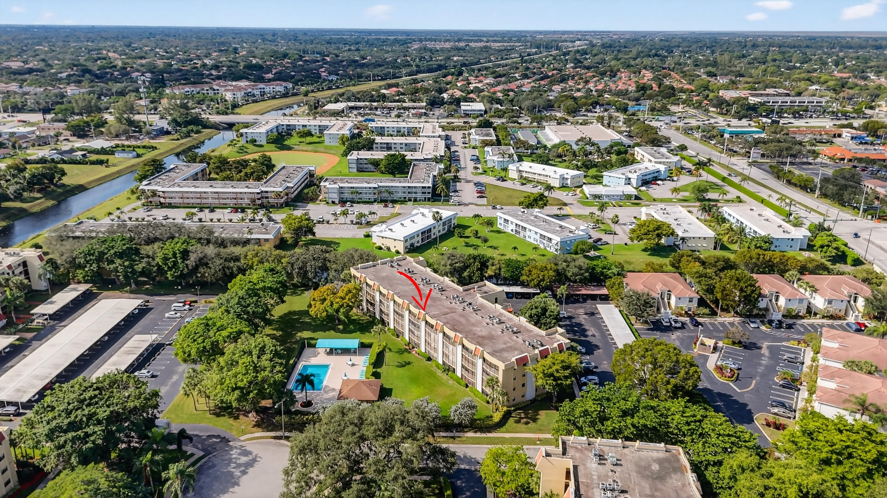 23345 Carolwood Lane, Unit 205 Boca Raton, FL 33428 - Photo 57 of 59 an aerial view of residential houses with city view