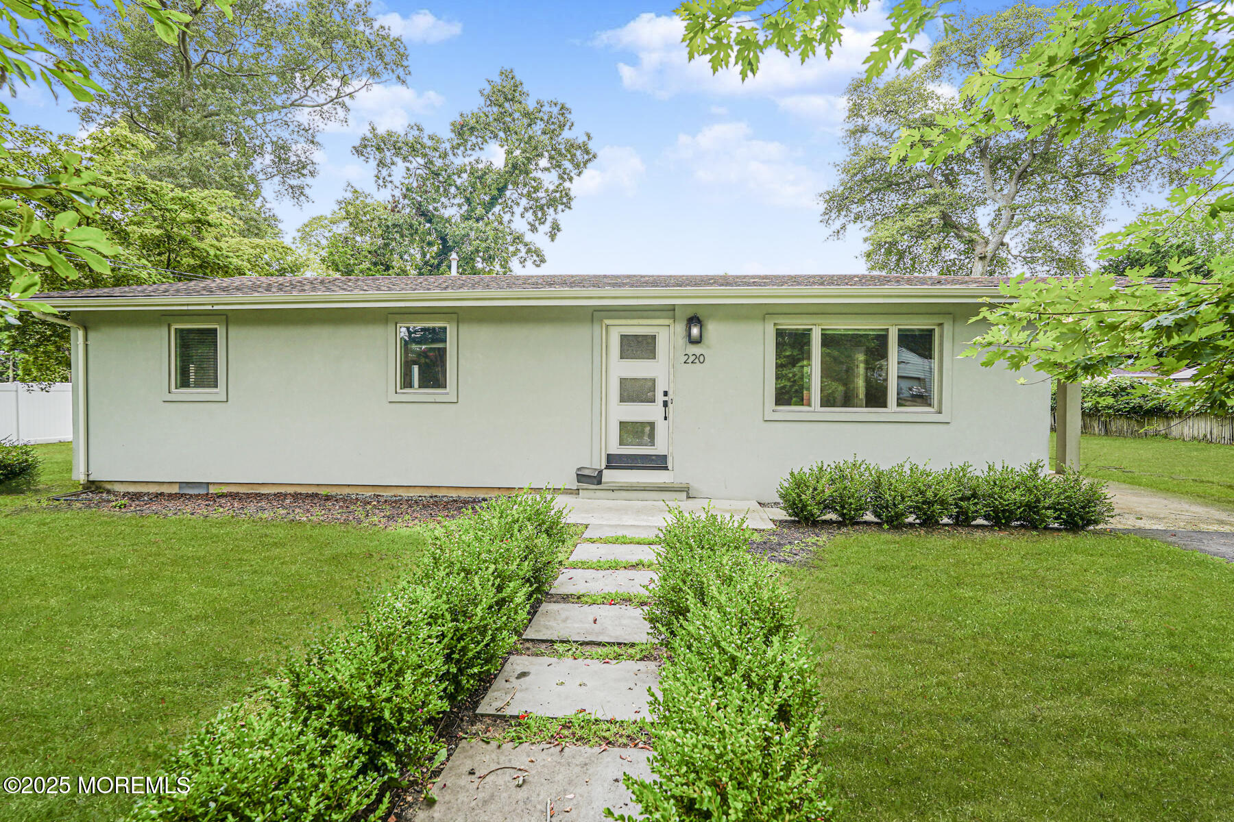 220 Highwood Road Oakhurst, NJ 07755 - Photo 2 of 30 a front view of a house with garden