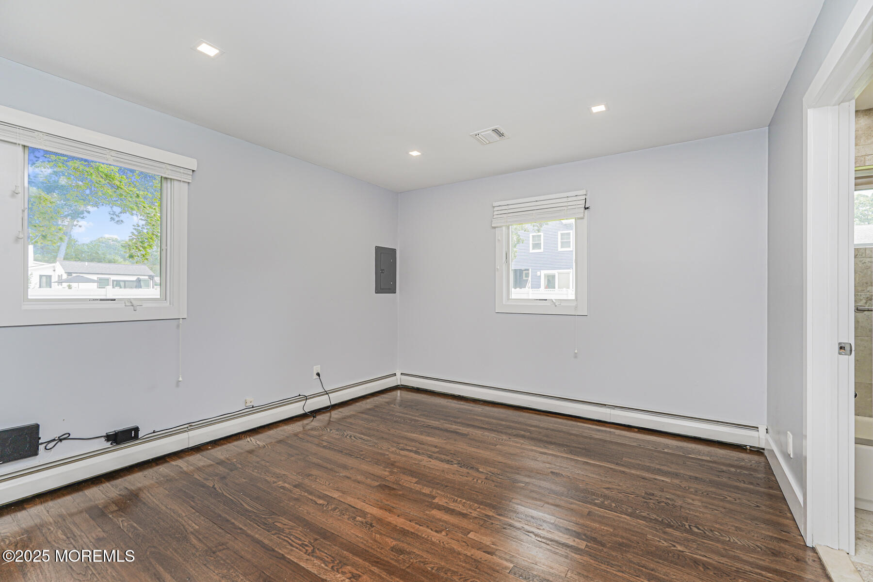 220 Highwood Road Oakhurst, NJ 07755 - Photo 21 of 30 a view of empty room with wooden floor and fan