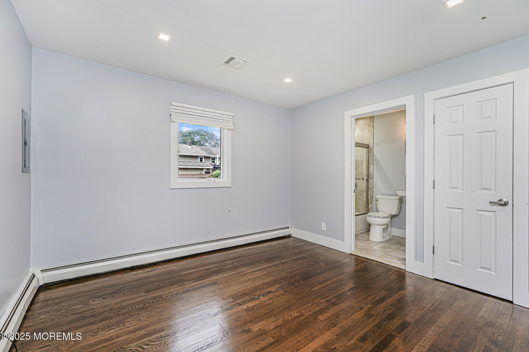 220 Highwood Road Oakhurst, NJ 07755 - Photo 23 of 30 wooden floor in an empty room with a window