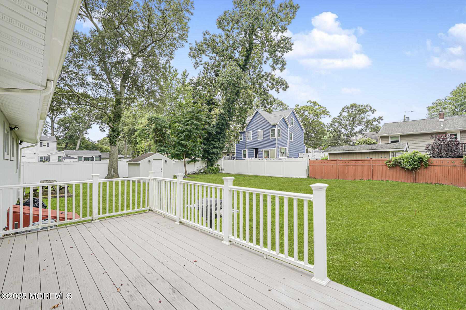 220 Highwood Road Oakhurst, NJ 07755 - Photo 25 of 30 a view of a deck with wooden floor and fence