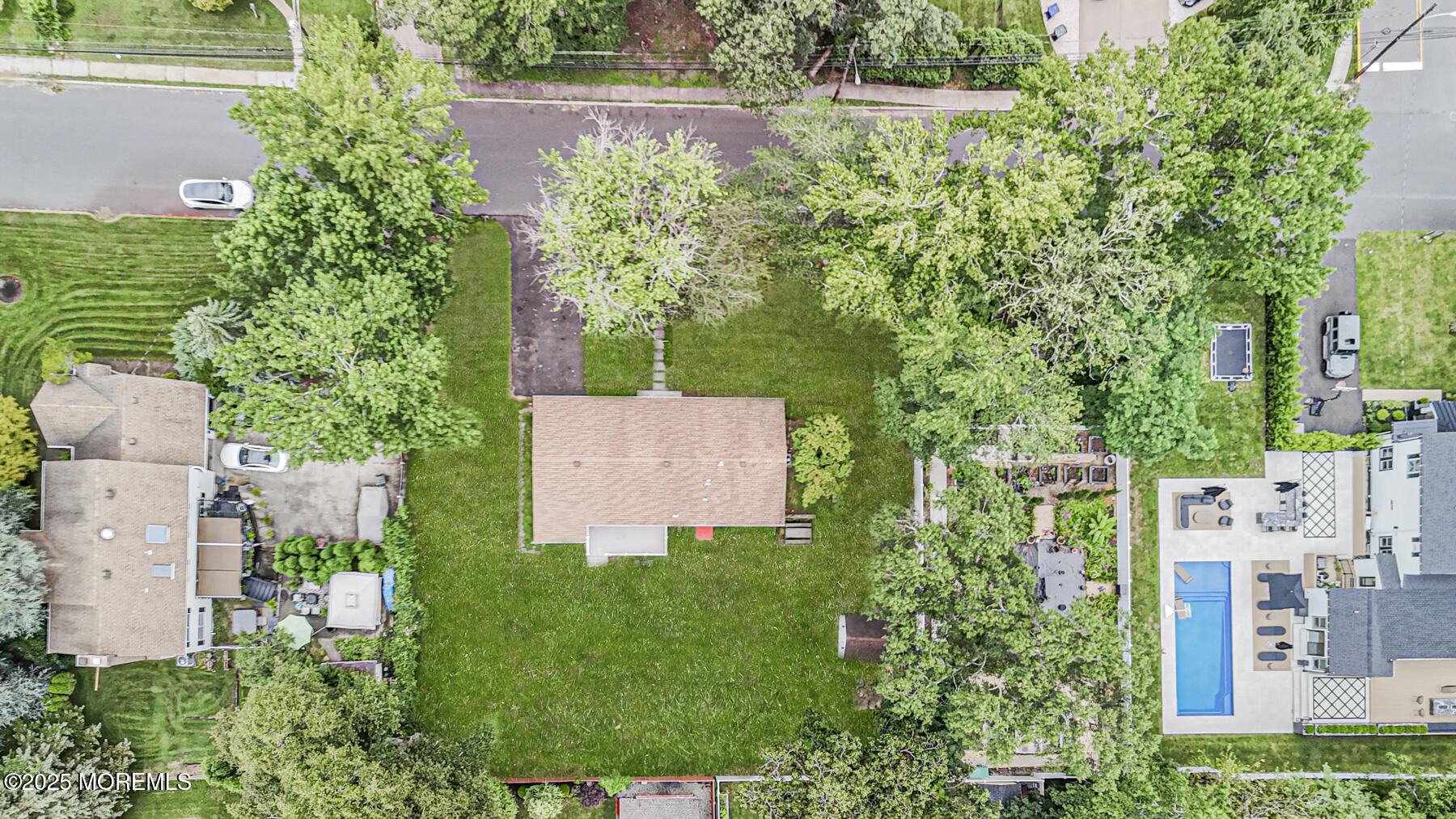 220 Highwood Road Oakhurst, NJ 07755 - Photo 30 of 30 an aerial view of residential house with outdoor space and trees all around