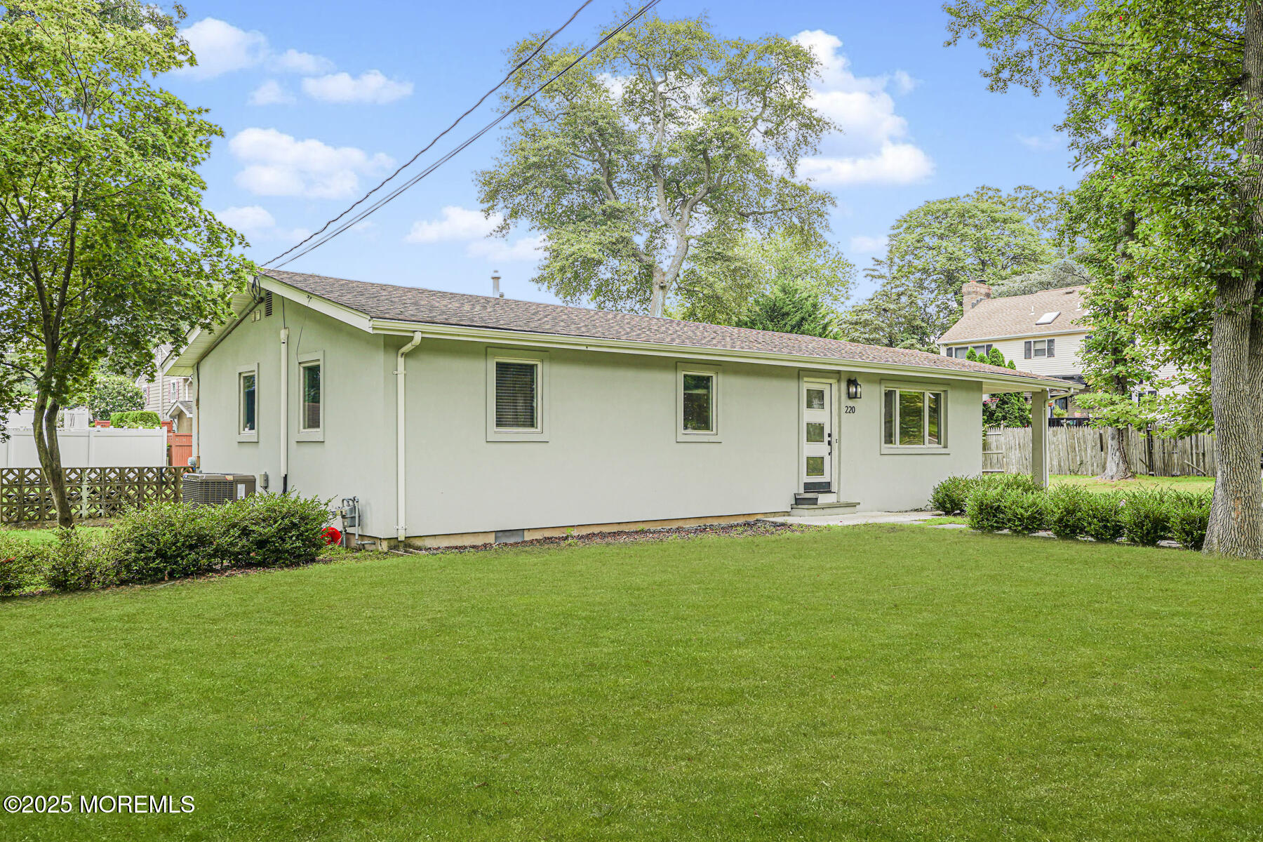 220 Highwood Road Oakhurst, NJ 07755 - Photo 3 of 30 a view of a house with a backyard