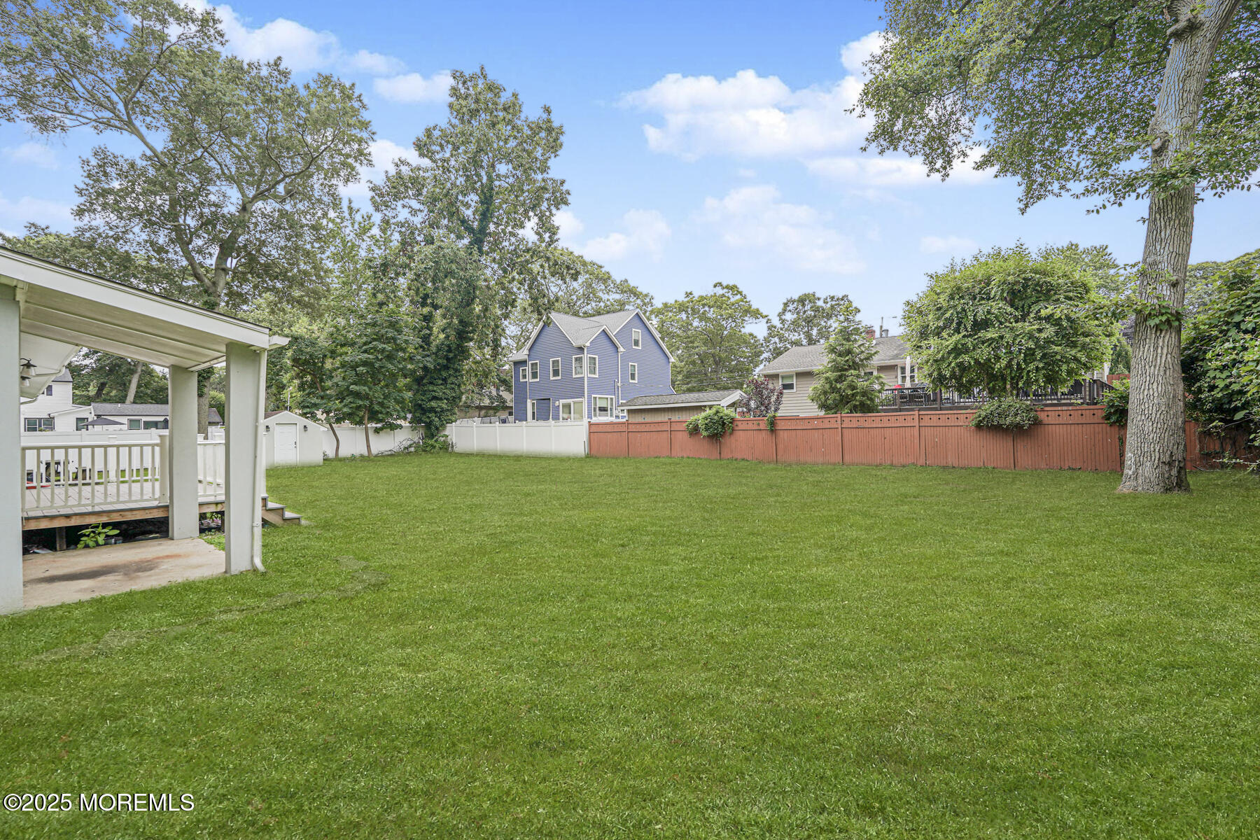 220 Highwood Road Oakhurst, NJ 07755 - Photo 7 of 30 a view of a house with a yard and sitting area