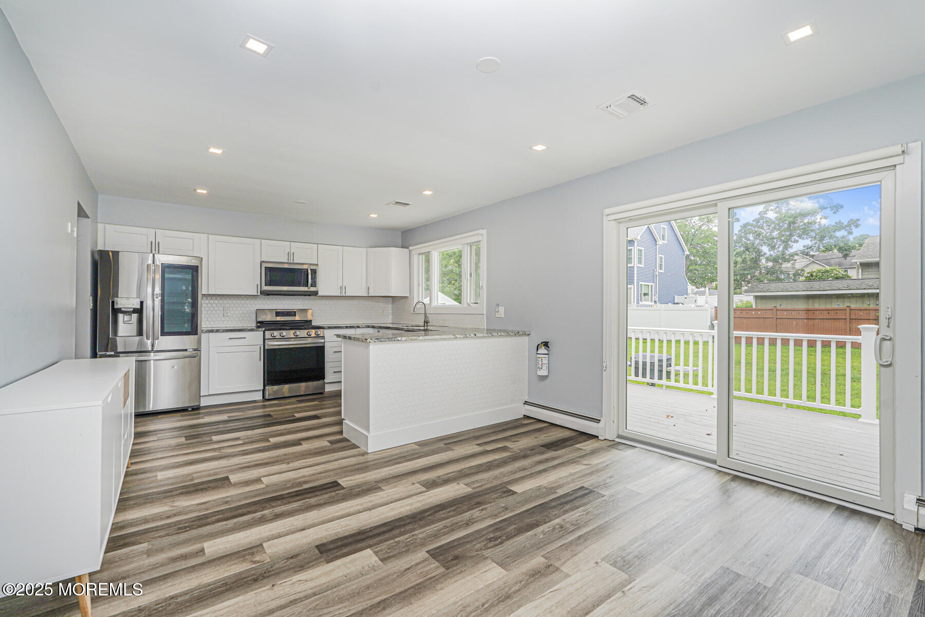 220 Highwood Road Oakhurst, NJ 07755 - Photo 9 of 30 a view of kitchen with granite countertop cabinets and stainless steel appliances