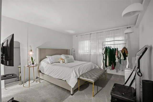 a bedroom with a bed and a walk in closet