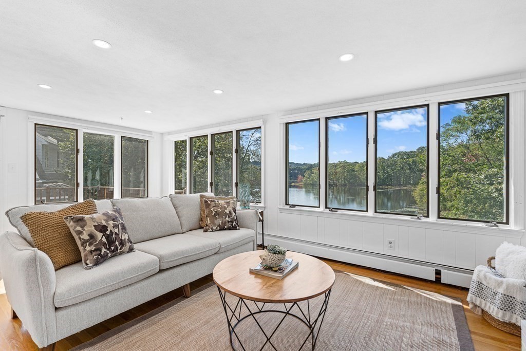 32 Woodside Road Winchester, MA 01890 - Photo 14 of 42 a living room with furniture and a large window
