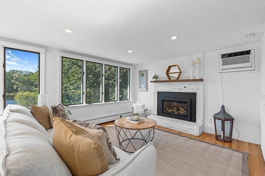 32 Woodside Road Winchester, MA 01890 - Photo 15 of 42 a living room with furniture and a fireplace