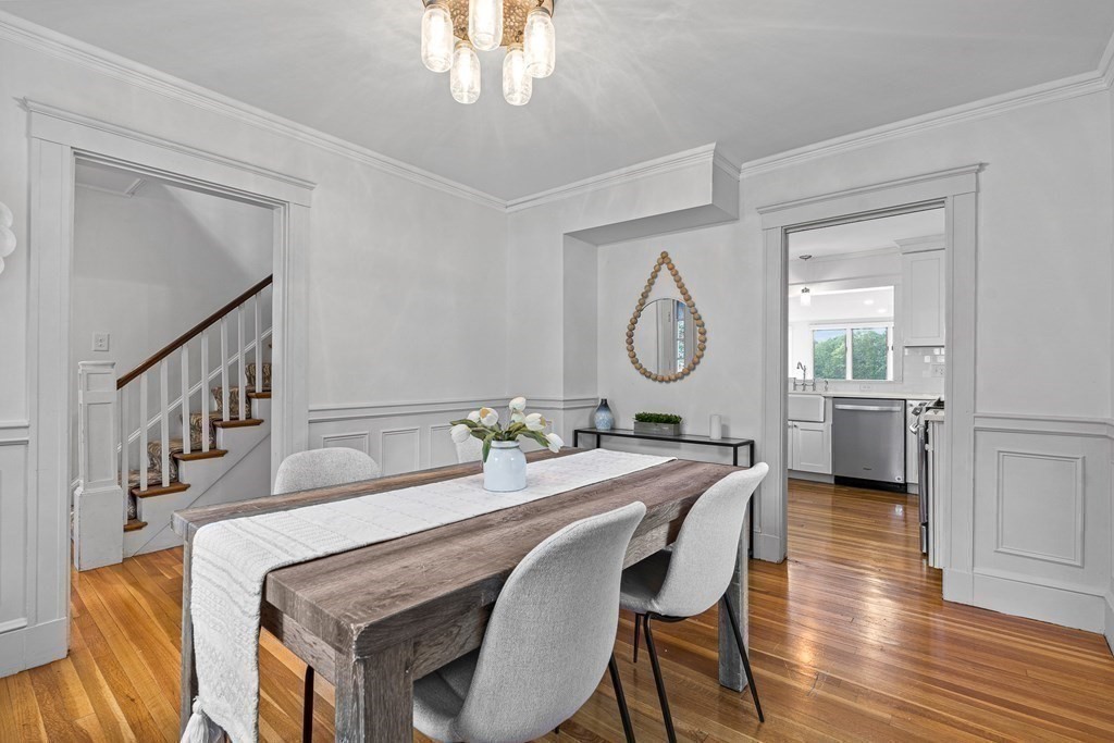 32 Woodside Road Winchester, MA 01890 - Photo 18 of 42 a view of a dining room with furniture and a chandelier