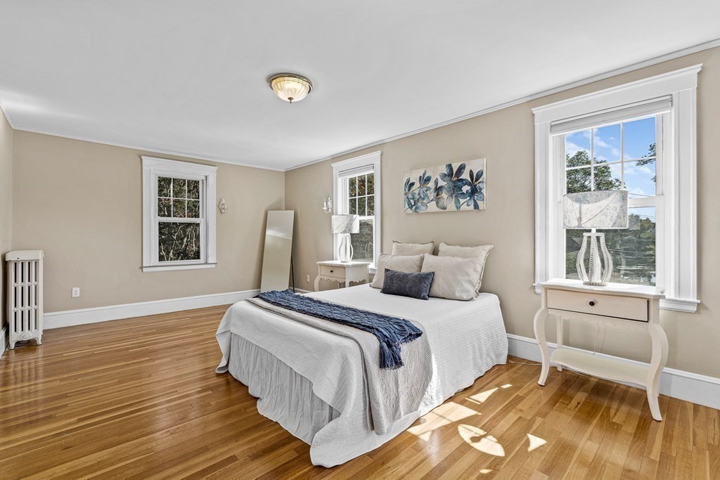 32 Woodside Road Winchester, MA 01890 - Photo 26 of 42 a bedroom with a large bed and a window