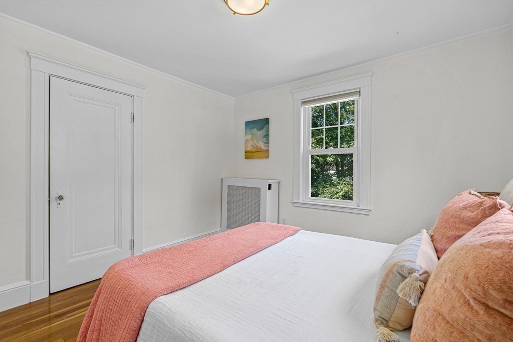 32 Woodside Road Winchester, MA 01890 - Photo 30 of 42 a bedroom with a bed and a window