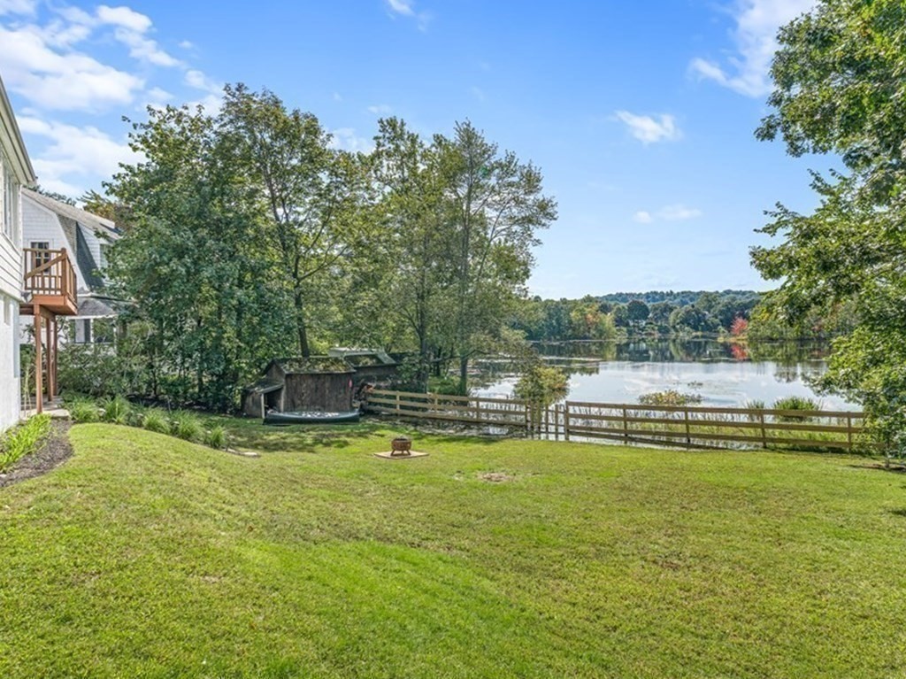 32 Woodside Road Winchester, MA 01890 - Photo 3 of 42 a view of a swimming pool with an outdoor seating and a garden