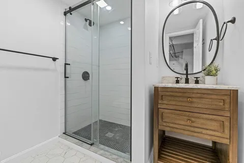 an empty room with wooden floor and closet area