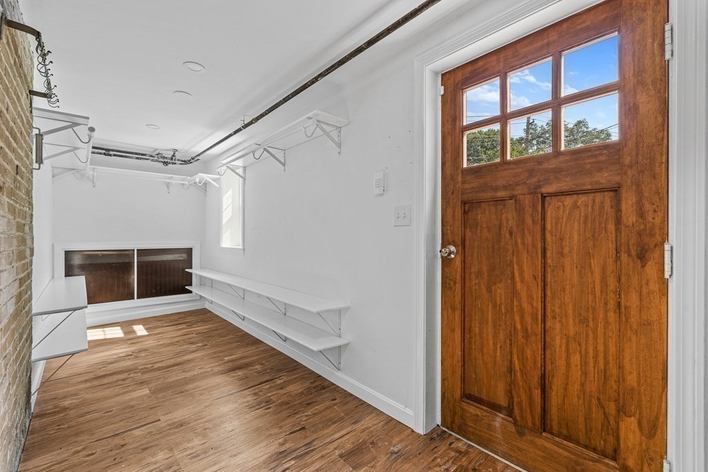 32 Woodside Road Winchester, MA 01890 - Photo 35 of 42 a big room with wooden floor and windows
