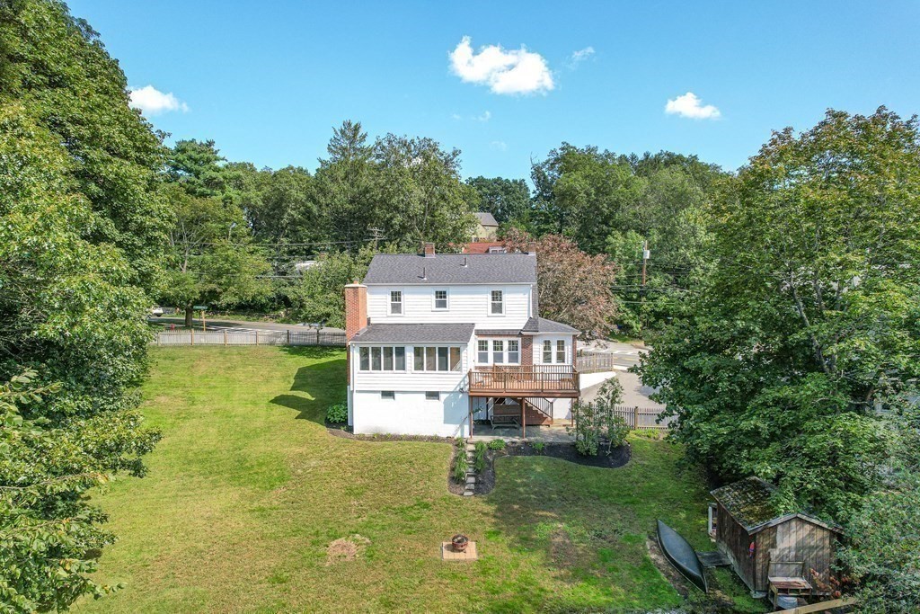 32 Woodside Road Winchester, MA 01890 - Photo 37 of 42 an aerial view of a house with a yard basket ball court and outdoor seating