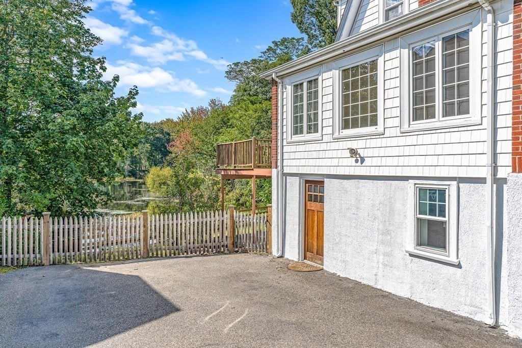 32 Woodside Road Winchester, MA 01890 - Photo 39 of 42 a view of a house with a wooden fence