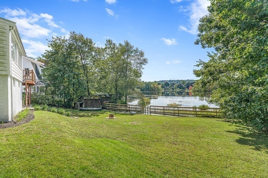 32 Woodside Road Winchester, MA 01890 - Photo 6 of 42 a view of a swimming pool with a garden