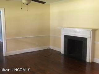 1217 Stockton Road Kinston, NC 28504 - Photo 5 of 20 fireplace in living room, ceiling fan and overhead light