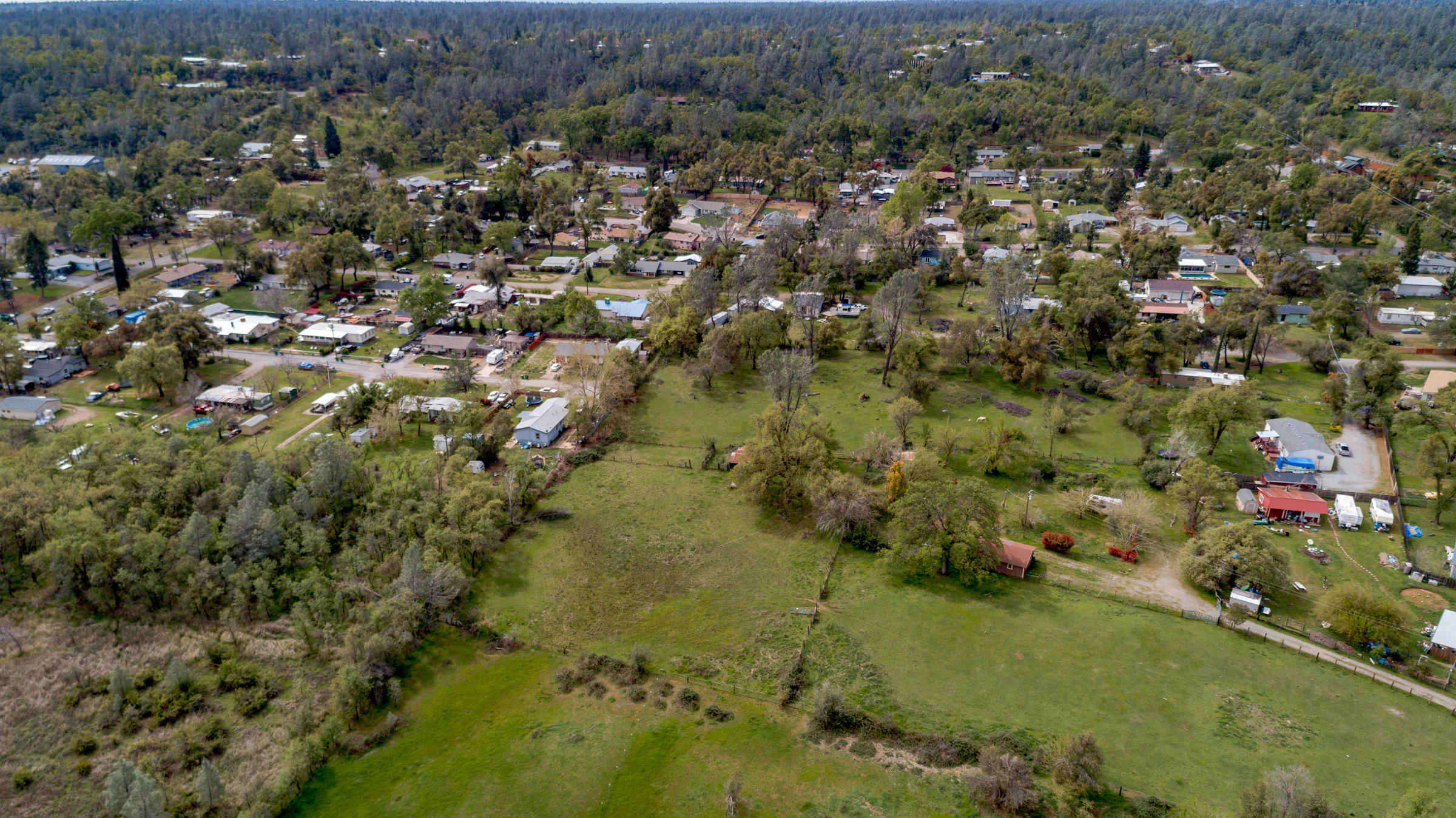 7681 Happy Valley Road Anderson, CA 96007 - Photo 5 of 25 an aerial view of residential houses with outdoor space and trees