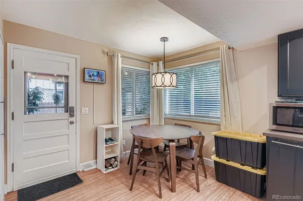 a dining room with furniture and window