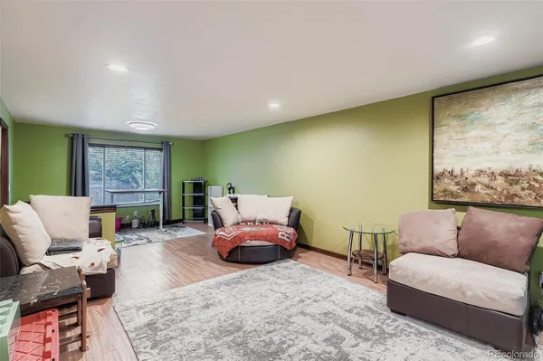 a living room with furniture or window and a wooden floor