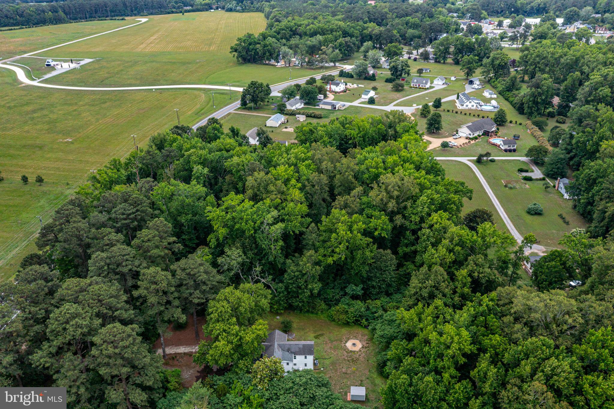 3952 Irvington Road Irvington, VA 22480 - Photo 50 of 77 an aerial view of residential houses with outdoor space and trees all around