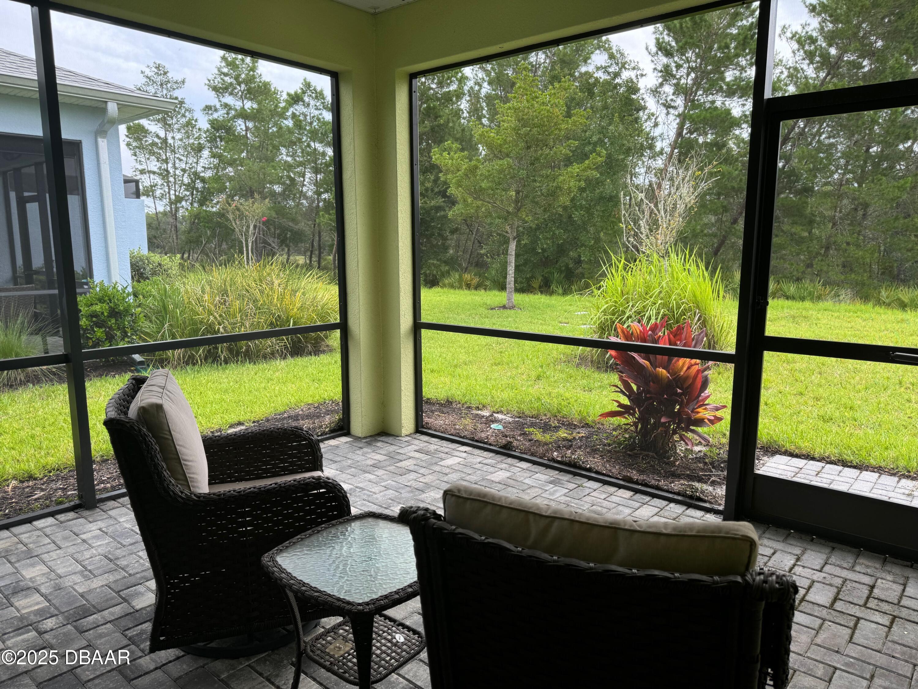 1016 Sea Shell Court Daytona Beach, FL 32124 - Photo 20 of 25 a view of a porch with furniture and a yard