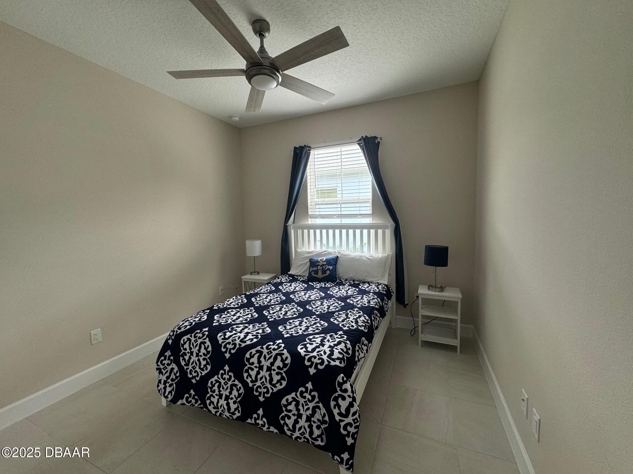 1016 Sea Shell Court Daytona Beach, FL 32124 - Photo 10 of 25 a bedroom with a bed window and a dresser