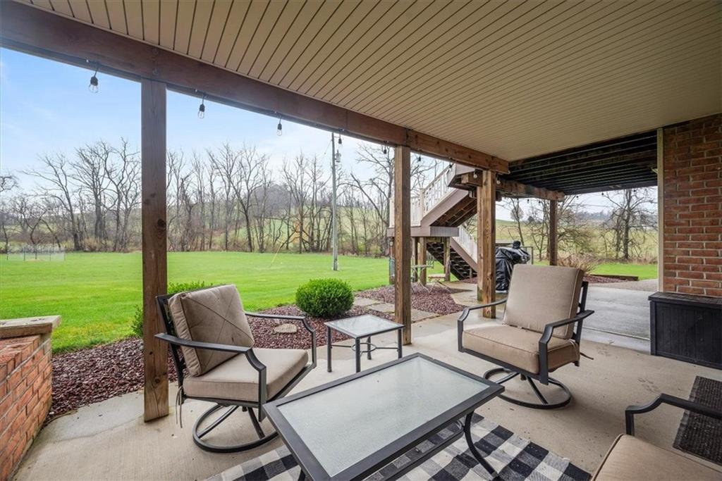11 Kings Road Washington, PA 15301 - Photo 45 of 49 a view of a patio with table and chairs and a yard