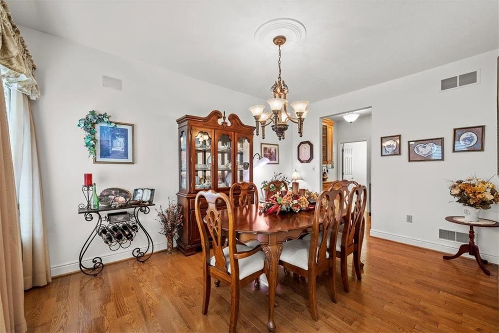 11 Kings Road Washington, PA 15301 - Photo 6 of 49 a view of a dining room with furniture a chandelier and wooden floor