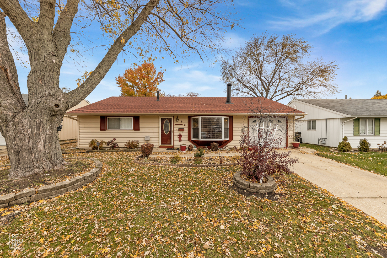 512 Audubon Road Streamwood, IL 60107 - Photo 1 of 10 a front view of a house with yard patio and fire pit