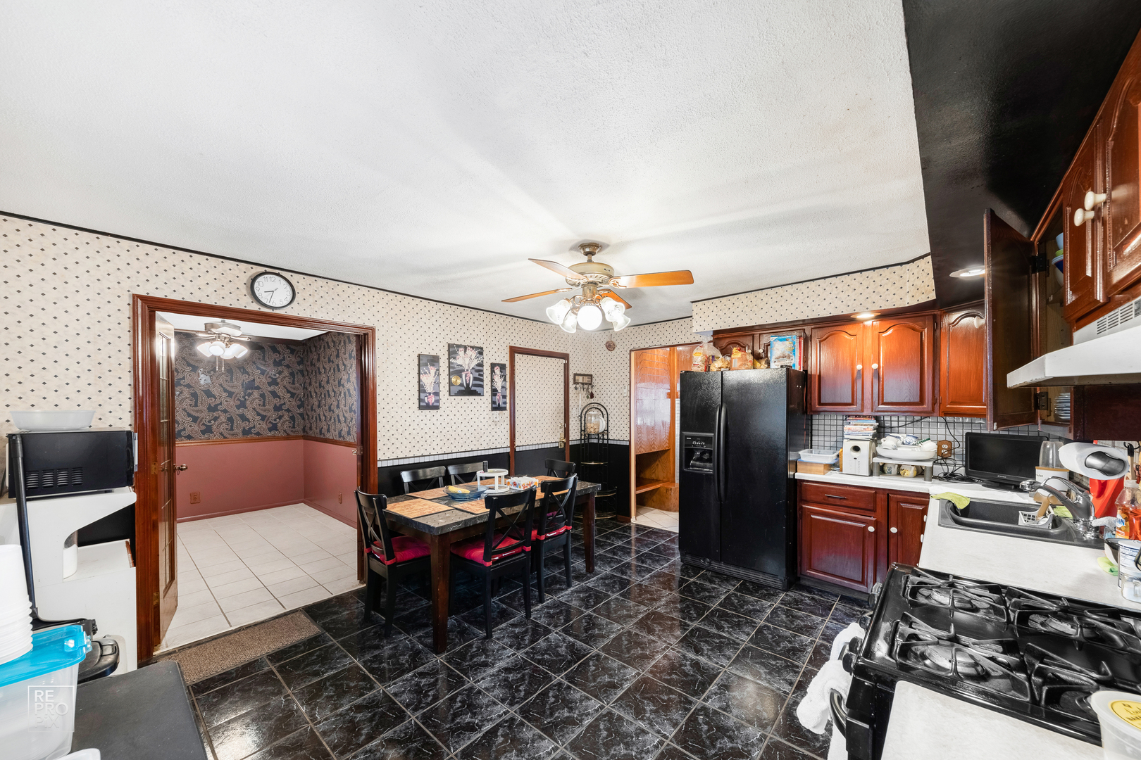 512 Audubon Road Streamwood, IL 60107 - Photo 5 of 10 a living room with lots of furniture and a chandelier