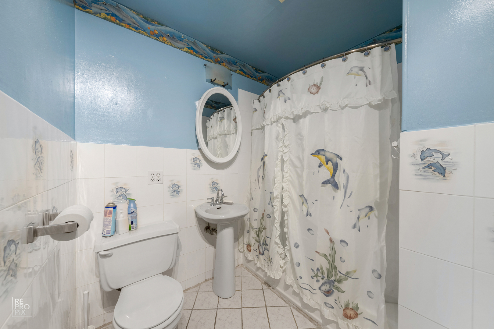 512 Audubon Road Streamwood, IL 60107 - Photo 8 of 10 a white toilet sitting next to a bathroom sink