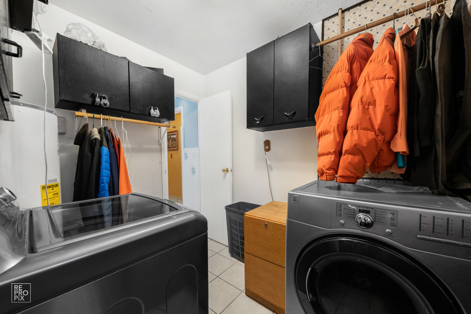 512 Audubon Road Streamwood, IL 60107 - Photo 9 of 10 a view of walk in closet with clothes and shoes