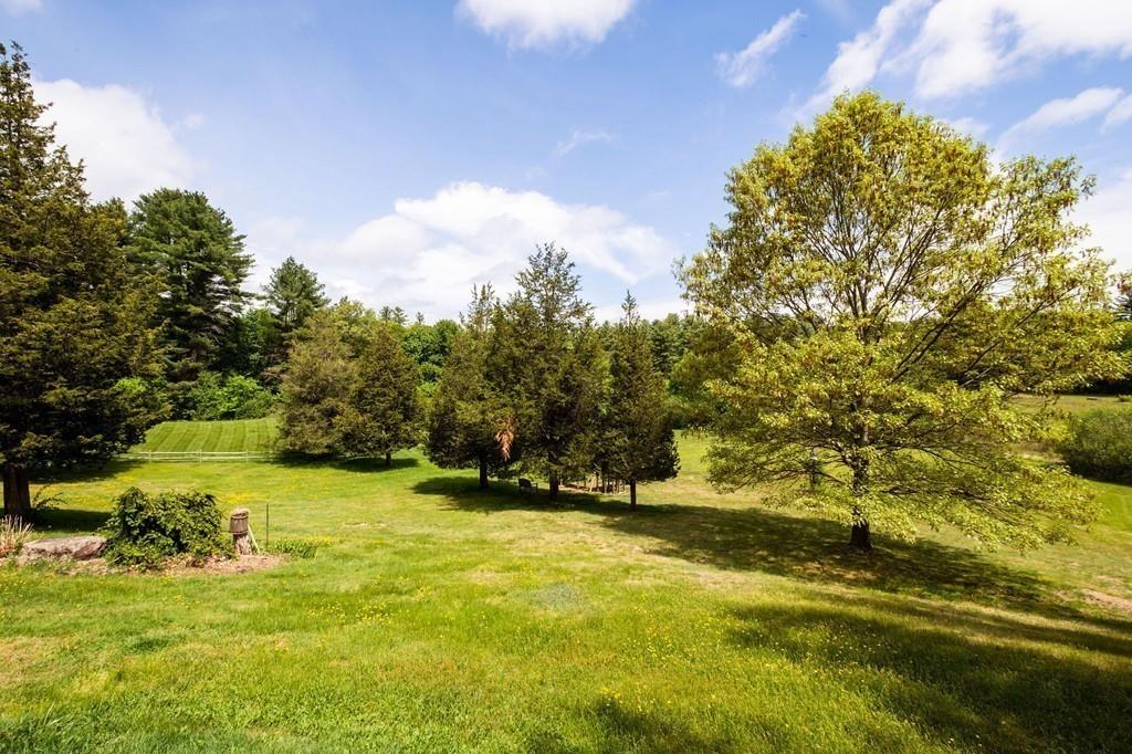 196 Middleton Road Boxford, MA 01921 - Photo 6 of 34 a view of yard with swimming pool and trees in the background