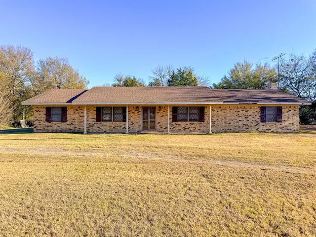 a front view of a house with swimming pool