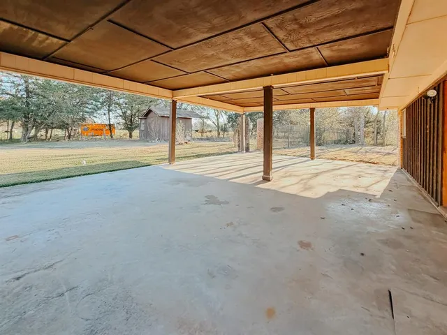 a view of a barn in the yard
