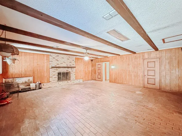 a view of a livingroom with furniture and a fireplace