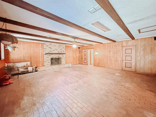wooden floor in an empty room and a window