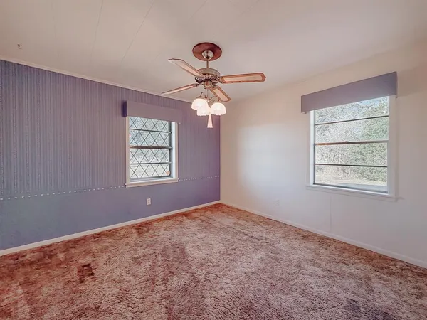 a view of a livingroom with a ceiling fan