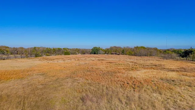an empty room with an ocean and trees