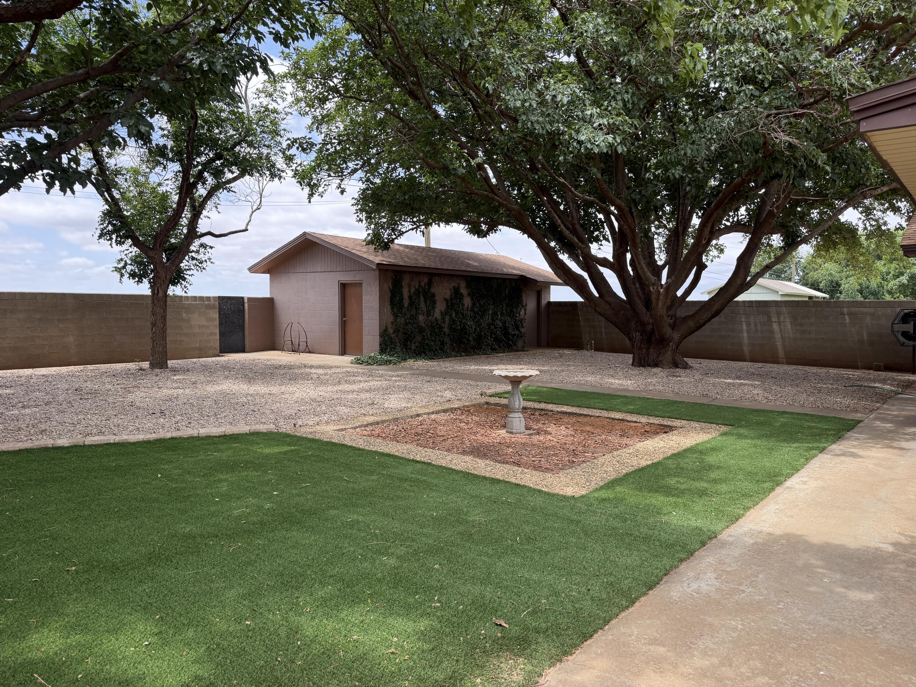 1603 South 8th Street Lamesa, TX 79331 - Photo 39 of 39 a front view of a house with a yard and tree