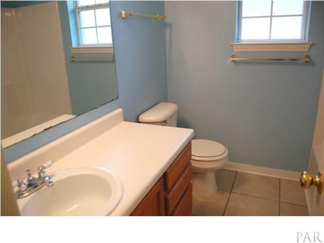 119 Gunwale Road Pensacola, FL 32507 - Photo 18 of 21 a bathroom with a sink vanity mirror and toilet