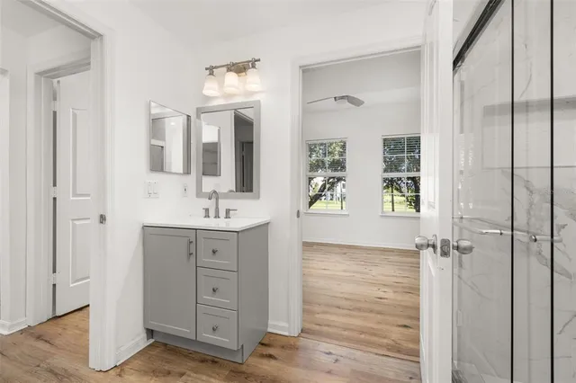 a bathroom with a granite countertop shower