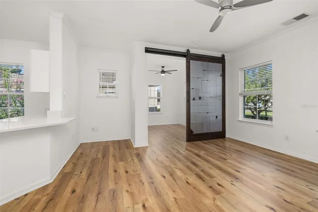 a kitchen with kitchen island a sink appliances and cabinets