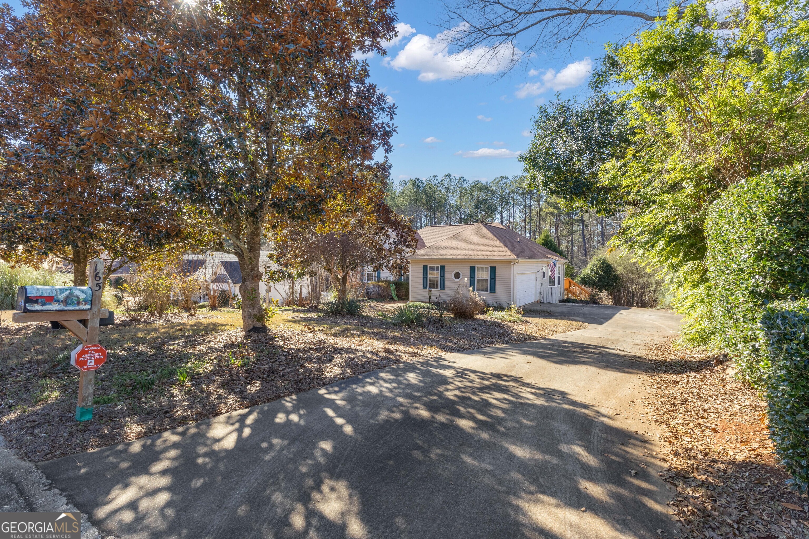165 Masters Drive Newnan, GA 30265 - Photo 2 of 63 a view of a house with yard and sitting area