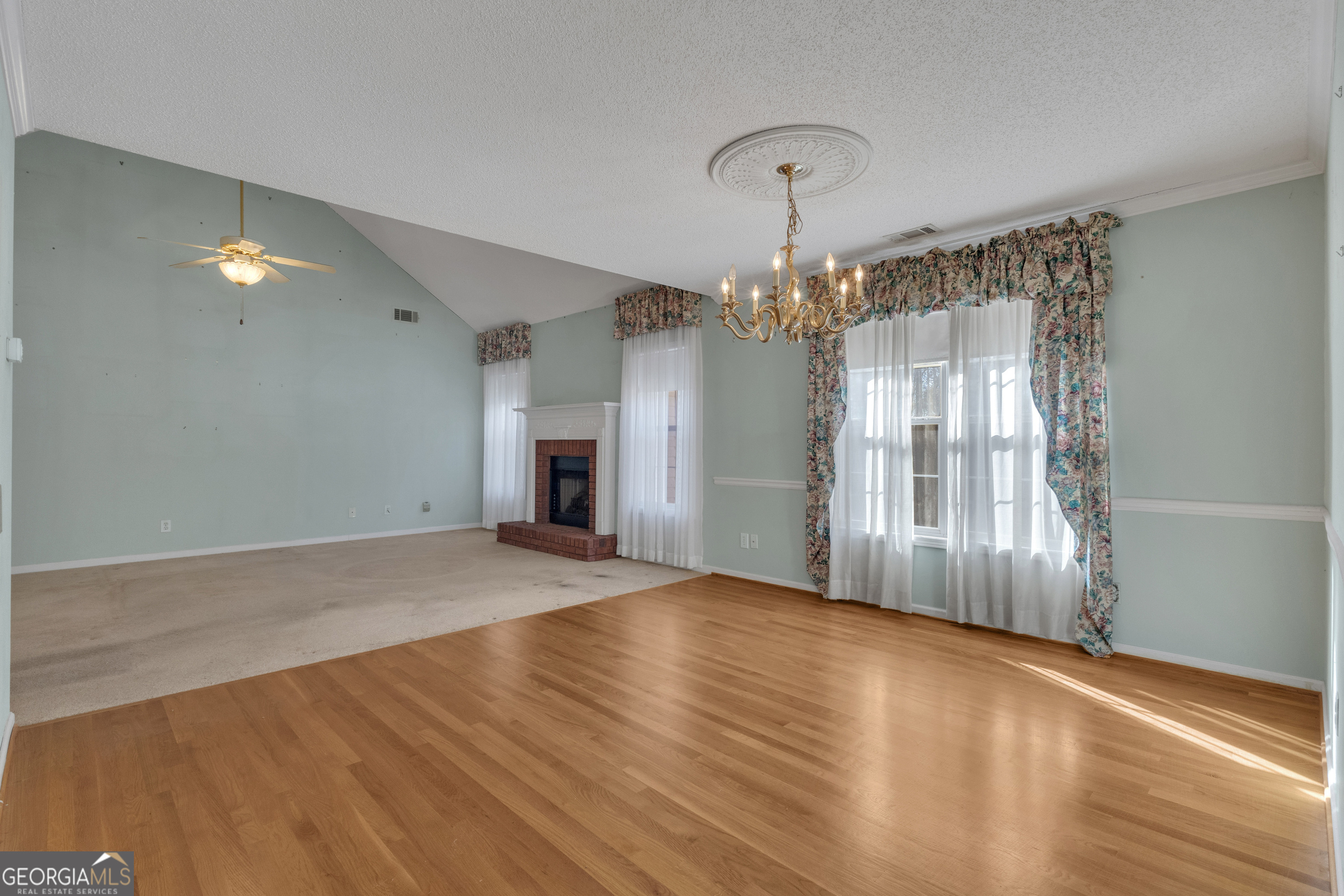 165 Masters Drive Newnan, GA 30265 - Photo 27 of 63 wooden floor in an empty room with a window