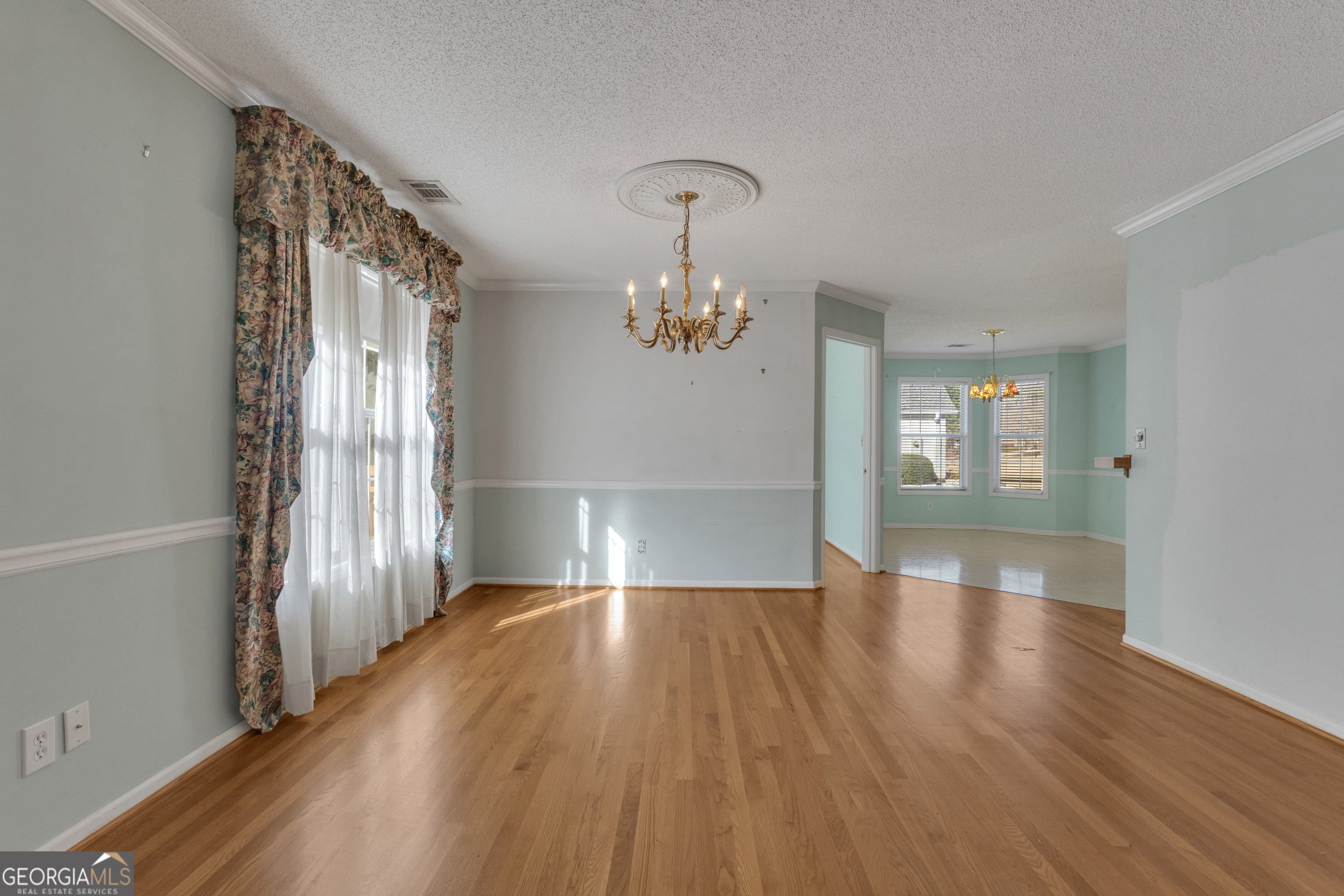 165 Masters Drive Newnan, GA 30265 - Photo 29 of 63 a view of an empty room with wooden floor and a window